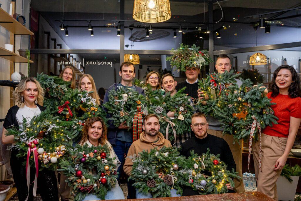 Festive wreath-making competition for Christmas decorations of Routine Automation team.