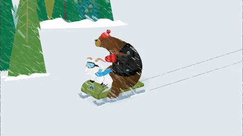 A bear and a goat enjoy a ride on a sled through the snowy landscape.